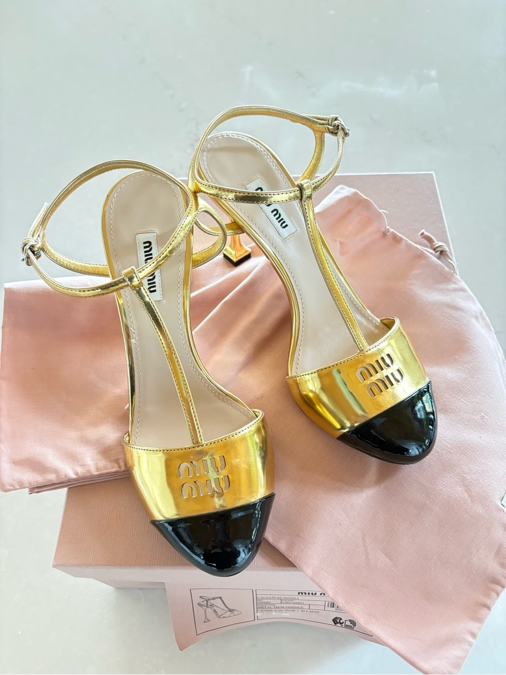 Miu Miu Metallic Gold T-Strap Heels with Black Cap Toe